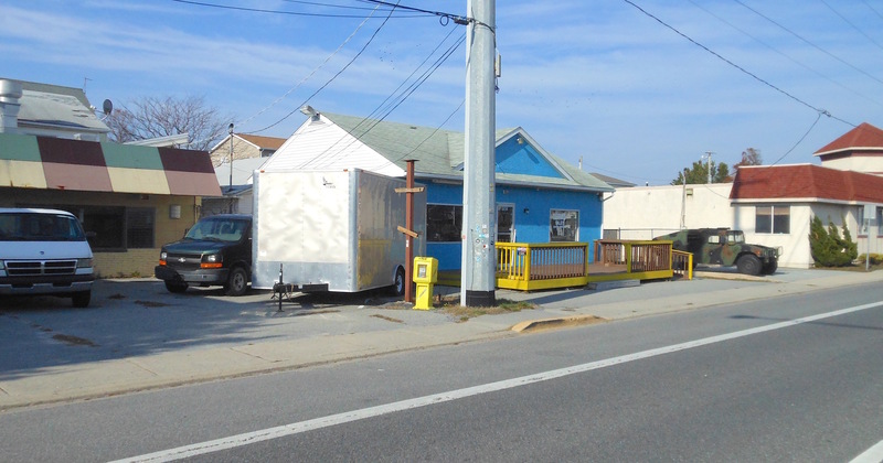 Dewey Beach officials have begun discussions on what to do with the land they purchased on Route 1 in March. Part of those discussions include the possible purchase of a string of land owned by Grotto Pizza between the blue, town-owned building and the white Grotto-owned building. BY CHRIS FLOOD
